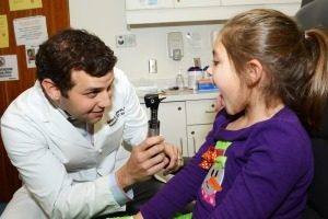 doctor performing sore throat treatment in birmingham alabama