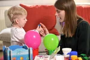 hearing loss specialist with child discussing hearing loss treatment options in Birmingham, Alabama