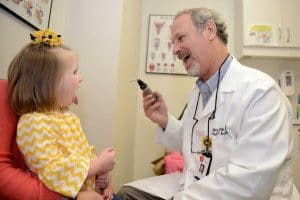 Pediatric ENT specialist with a patient during a consultation for a tonsillectomy and adenoidectomy