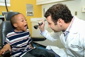 Dr. Kulbersh with a patient during an appointment for pediatric tonsillectomy and adenoidectomy in Birmingham