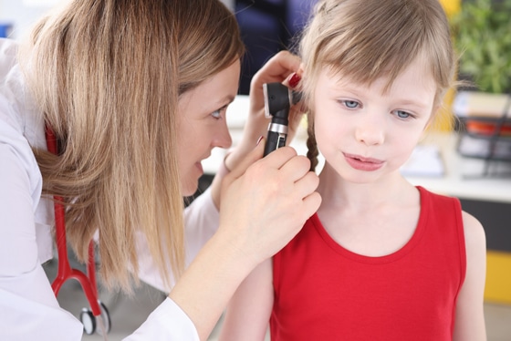 ent doctor reviewing kid's ears